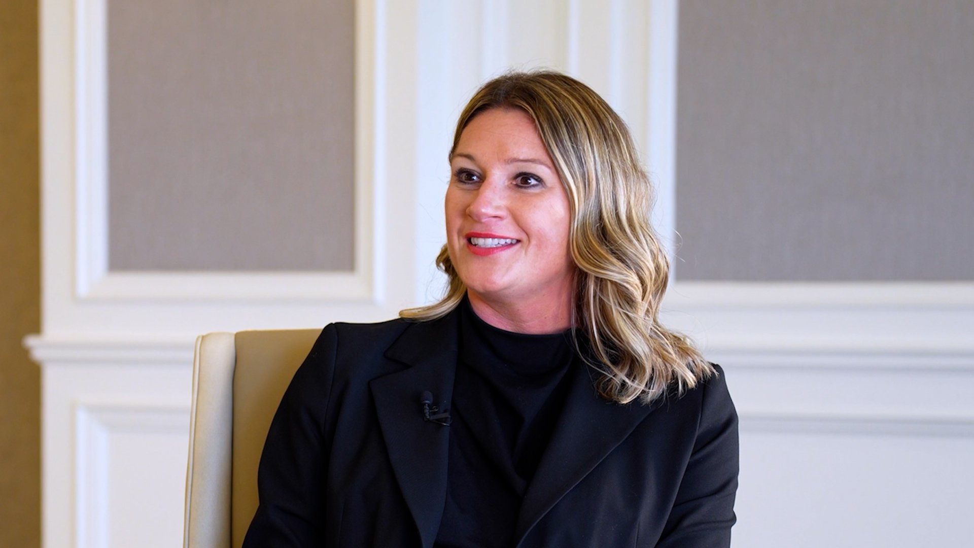 Natalie Ormos of GM Energy explaining how GM Energy connects EVs, homes, and the power grid